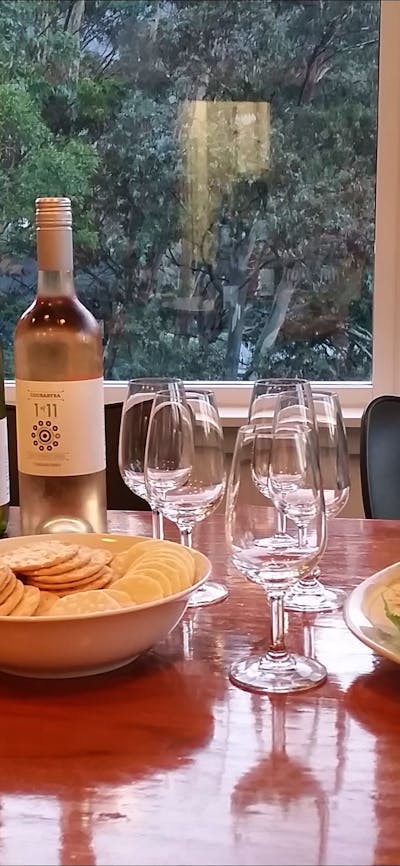 wine cheese crackers smoked trout anitpasto on table