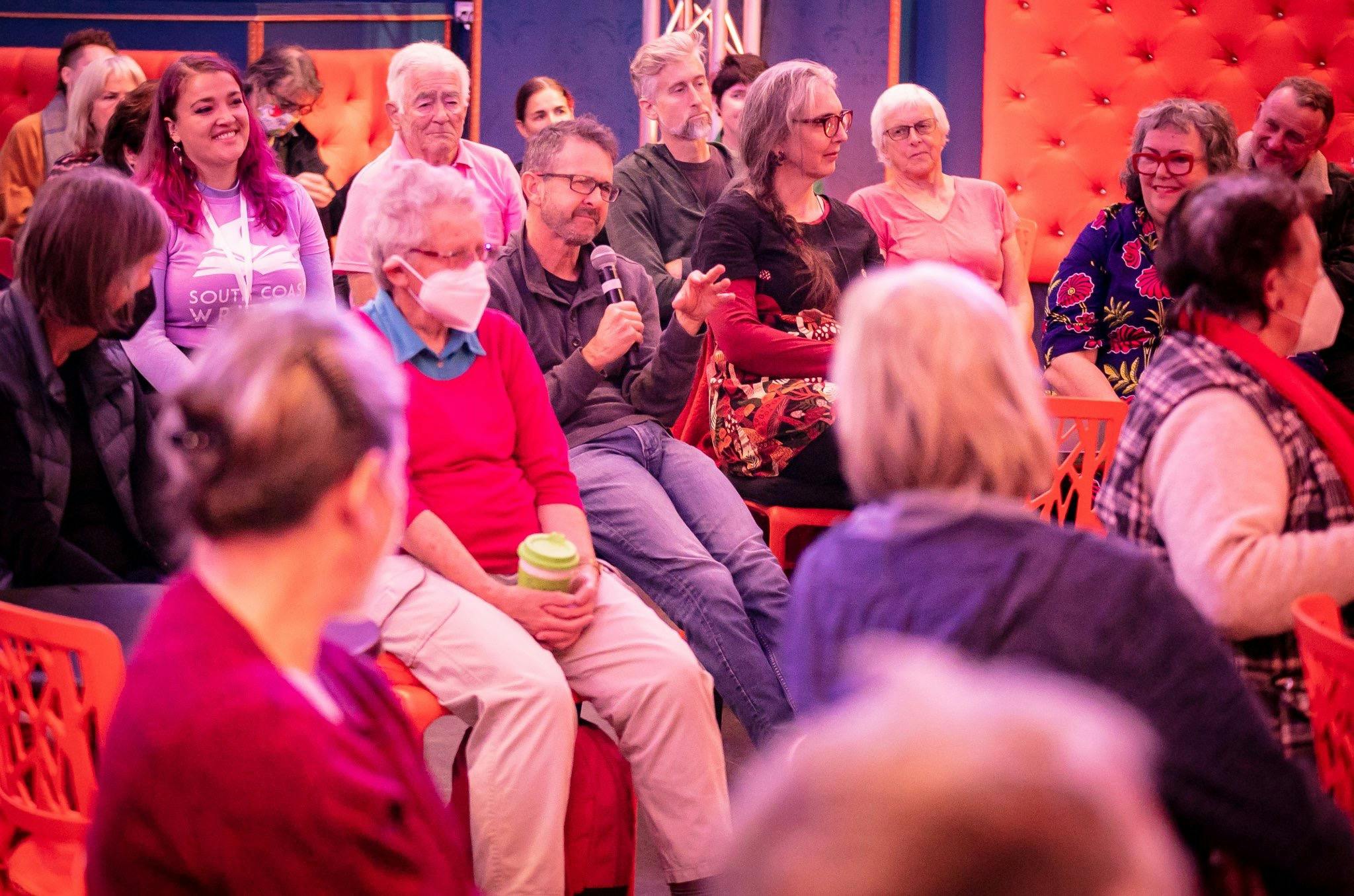 Audience member speaking into microphone