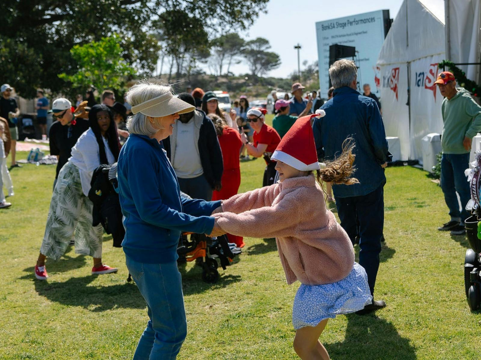 Visitors dancing to the music in front of the BankSA stage