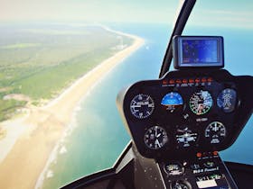 Photo of helicopter controls and beach