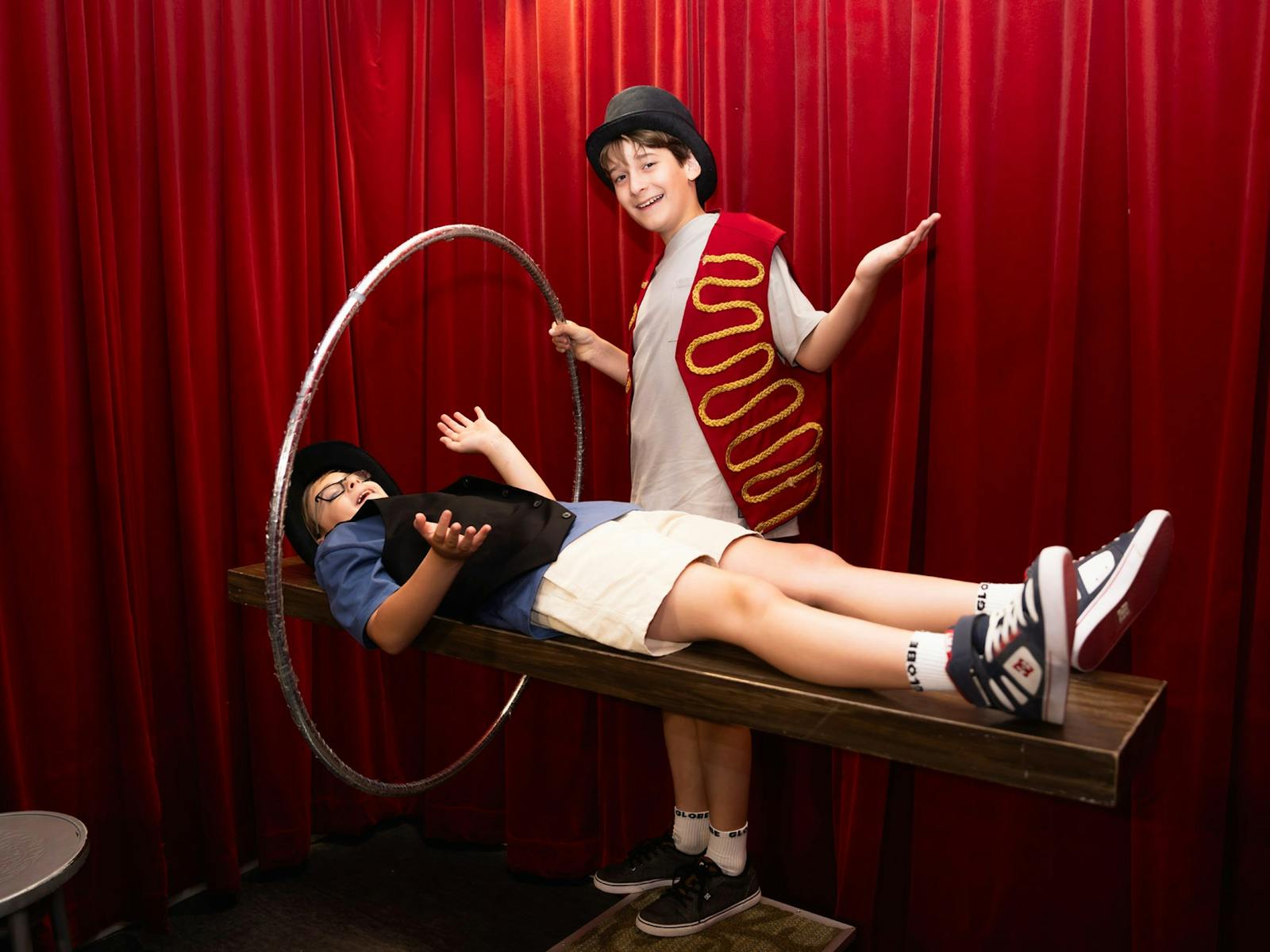 Kids learning magic at A Maze'N Things