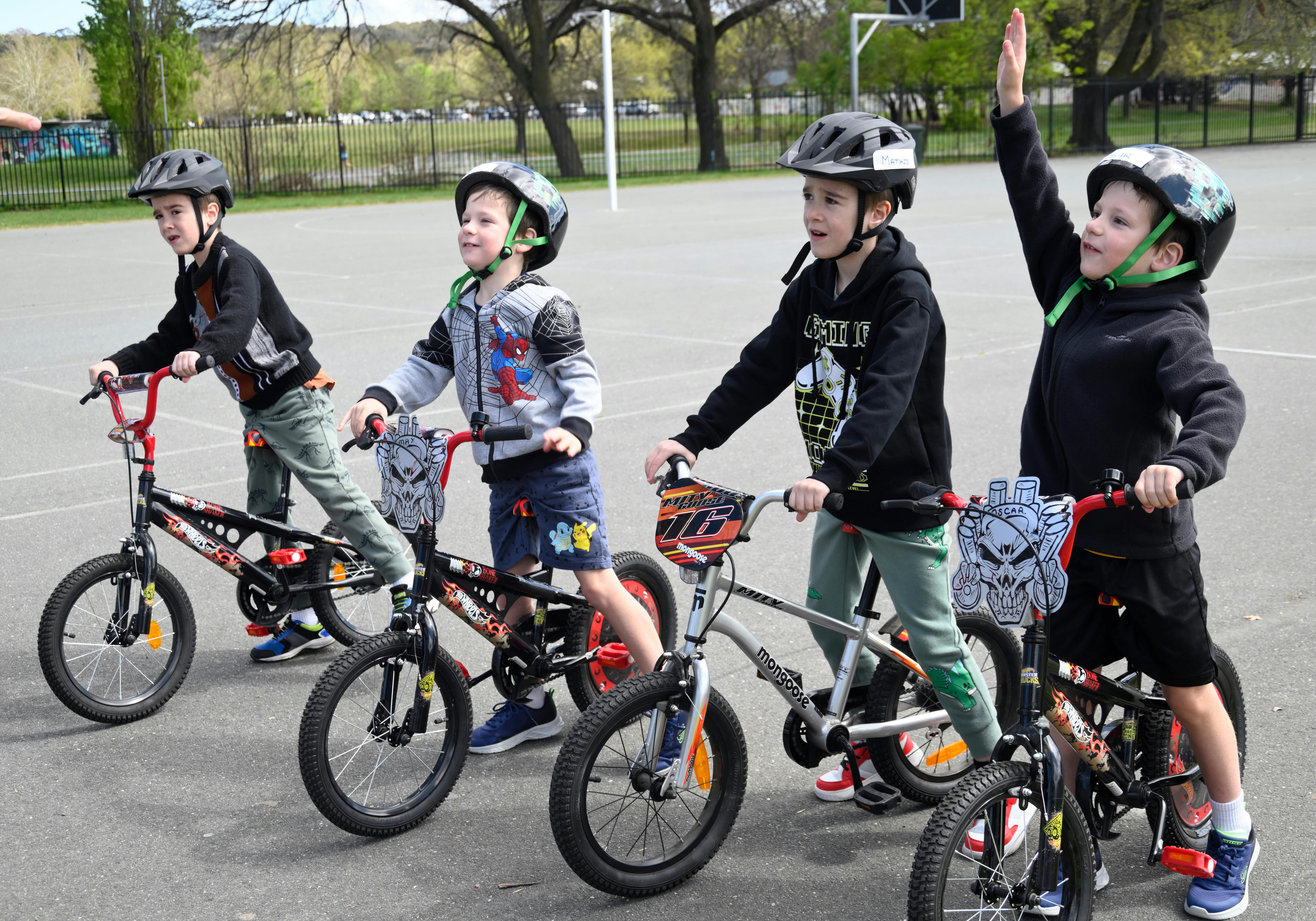 Four young boys with their bikes