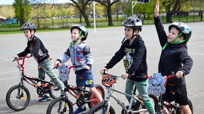Four young boys with their bikes