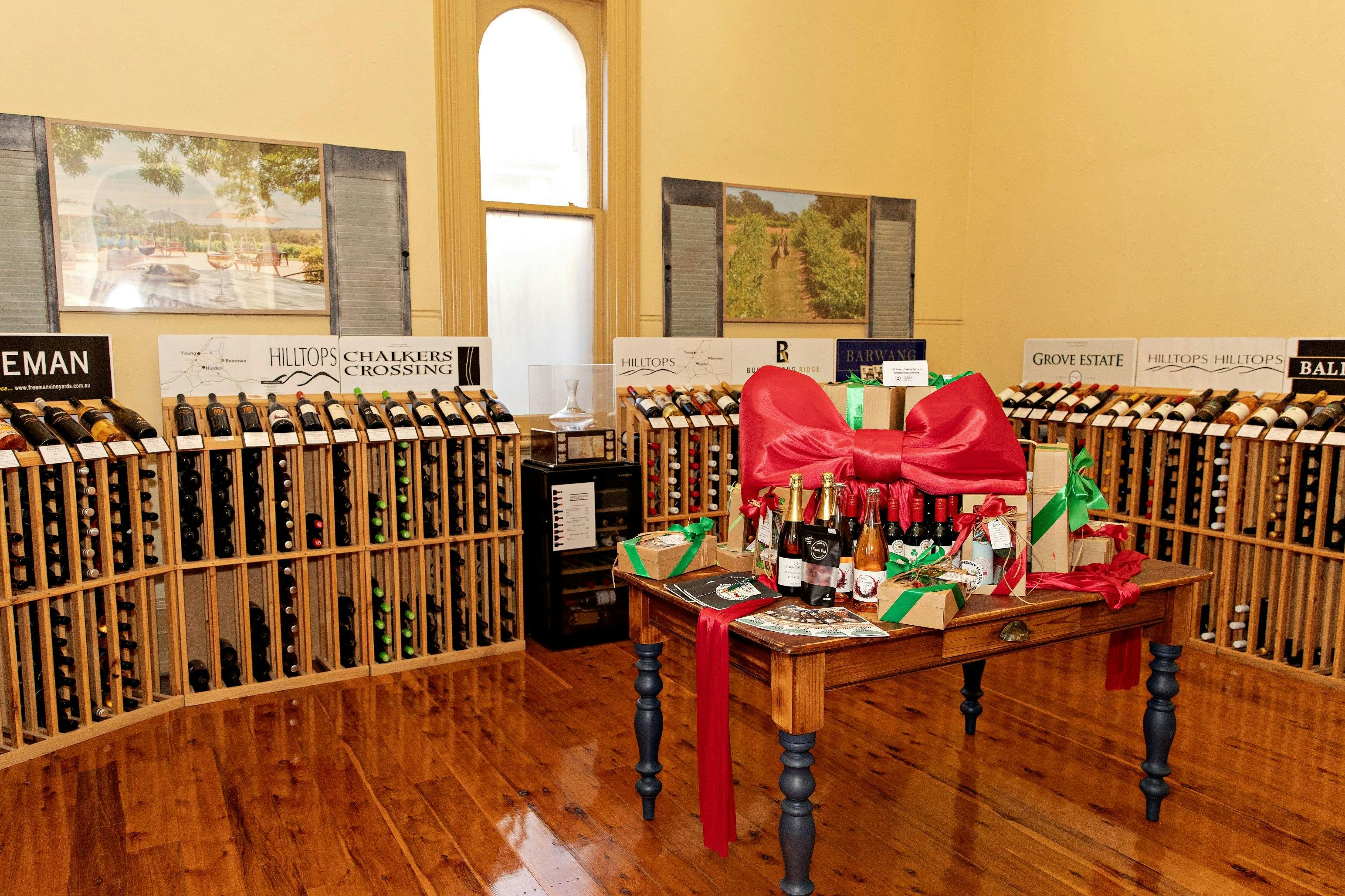 Most recent image of the wine cellar, complete with central display table & vineyard frames on walls