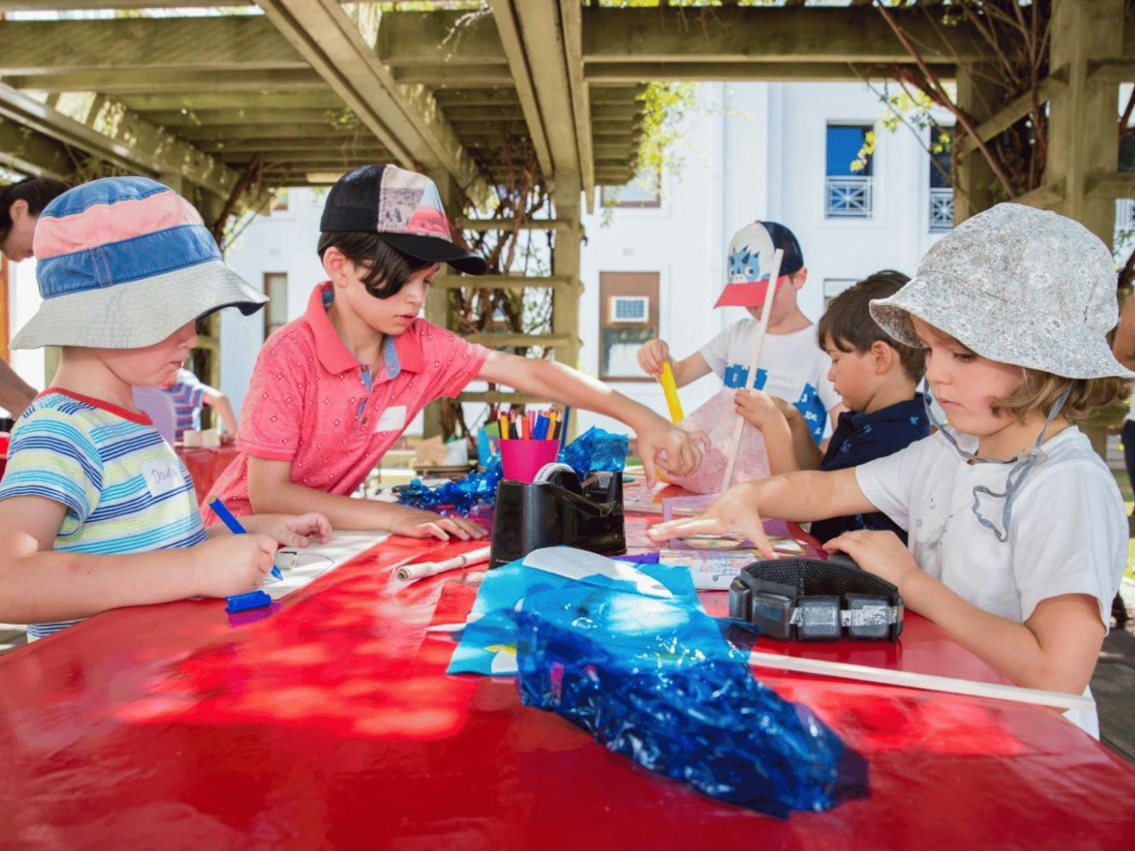 Children at MoAD doing craft activities outside
