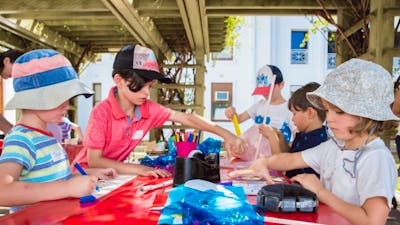 Children at MoAD doing craft activities outside