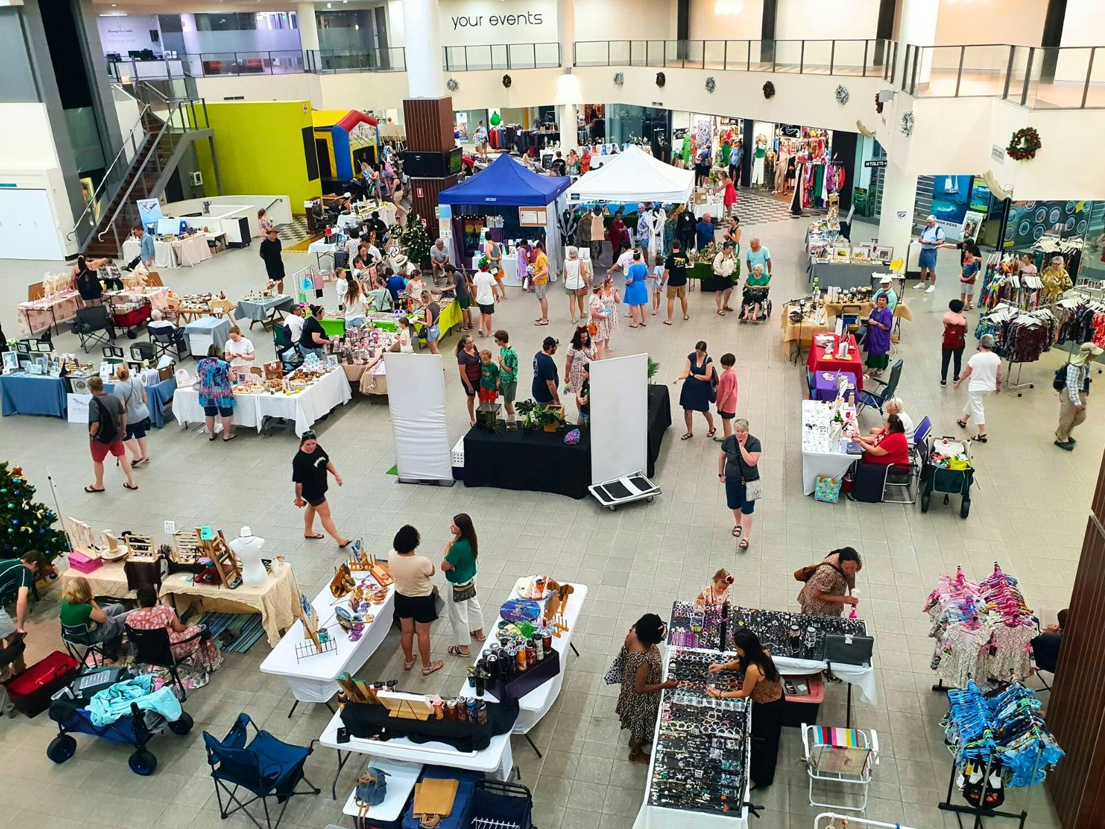 People browsing the stalls at The Pier Markets