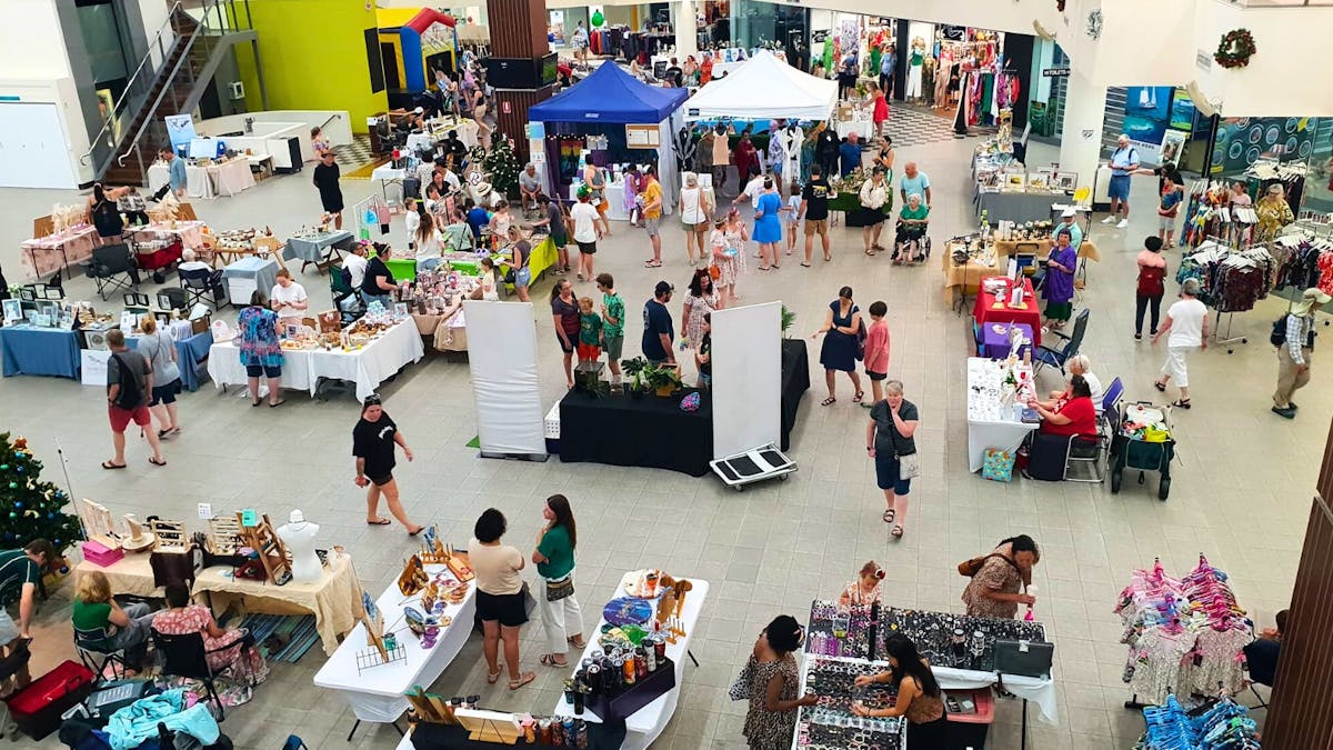 People browsing the stalls at The Pier Markets
