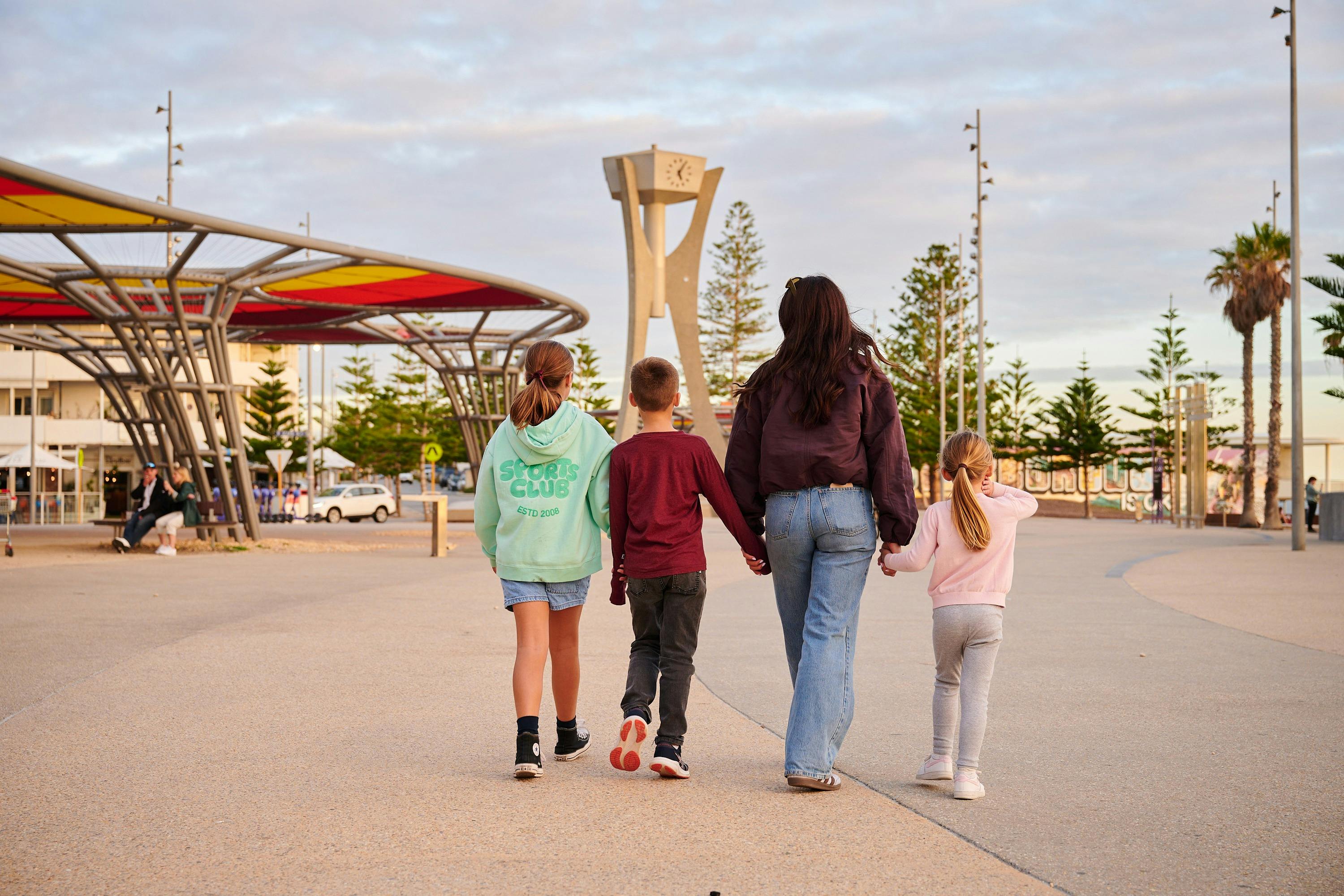 Family walking along Scarborough Beach esplanade
