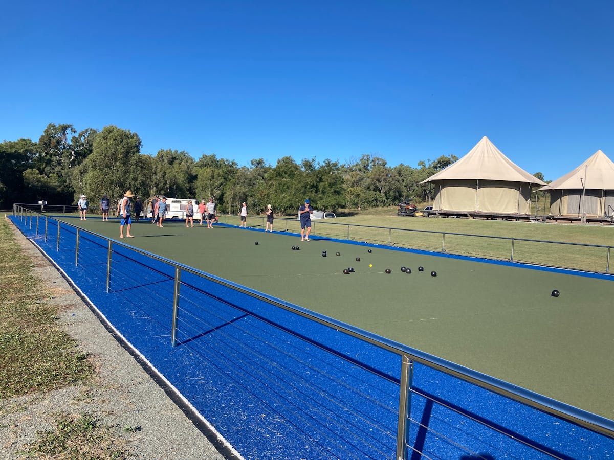 People playing lawn bowls on bowling green