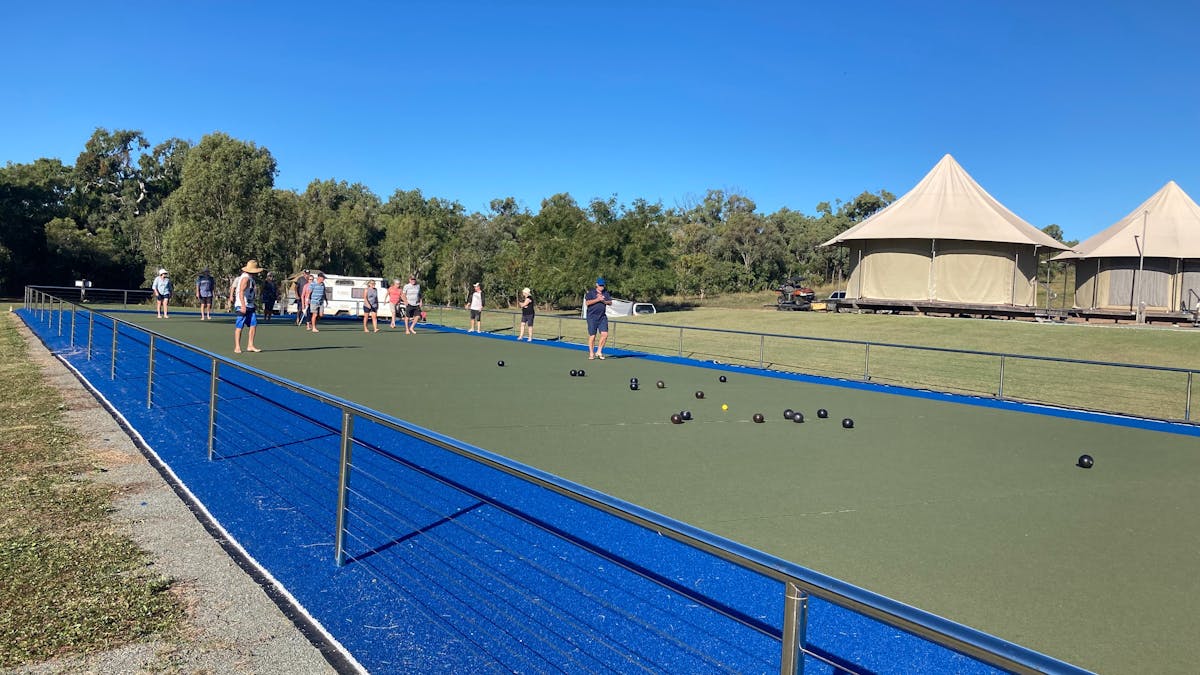 People playing lawn bowls on bowling green