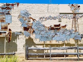 Mural of sheep and horses made of corrugated iron