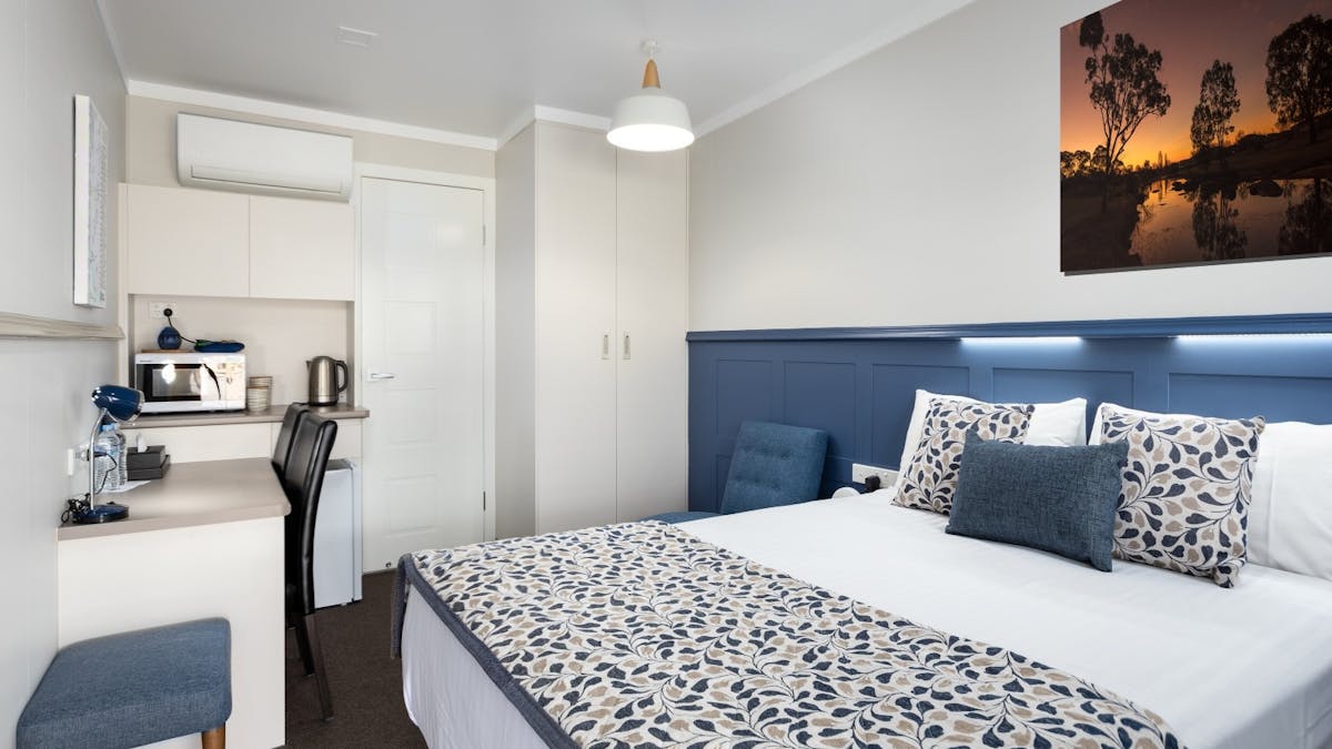 Bedroom in our Deluxe Queen Rooms