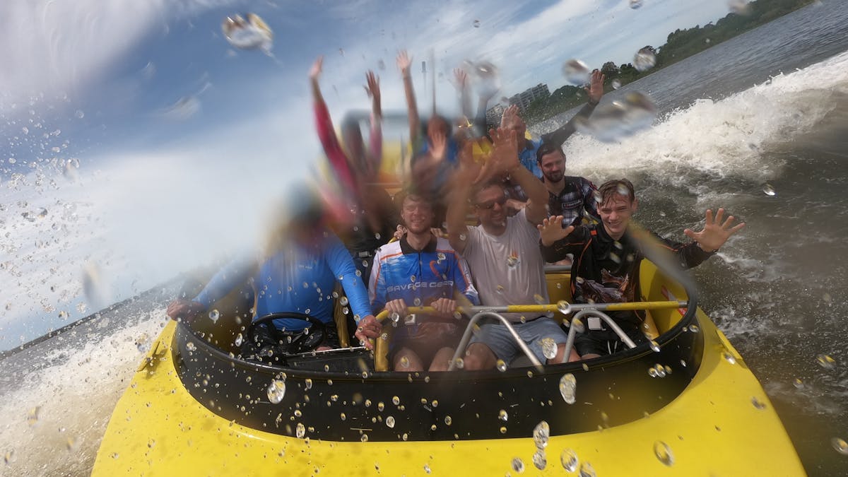 Passengers enjoying jet boat ride