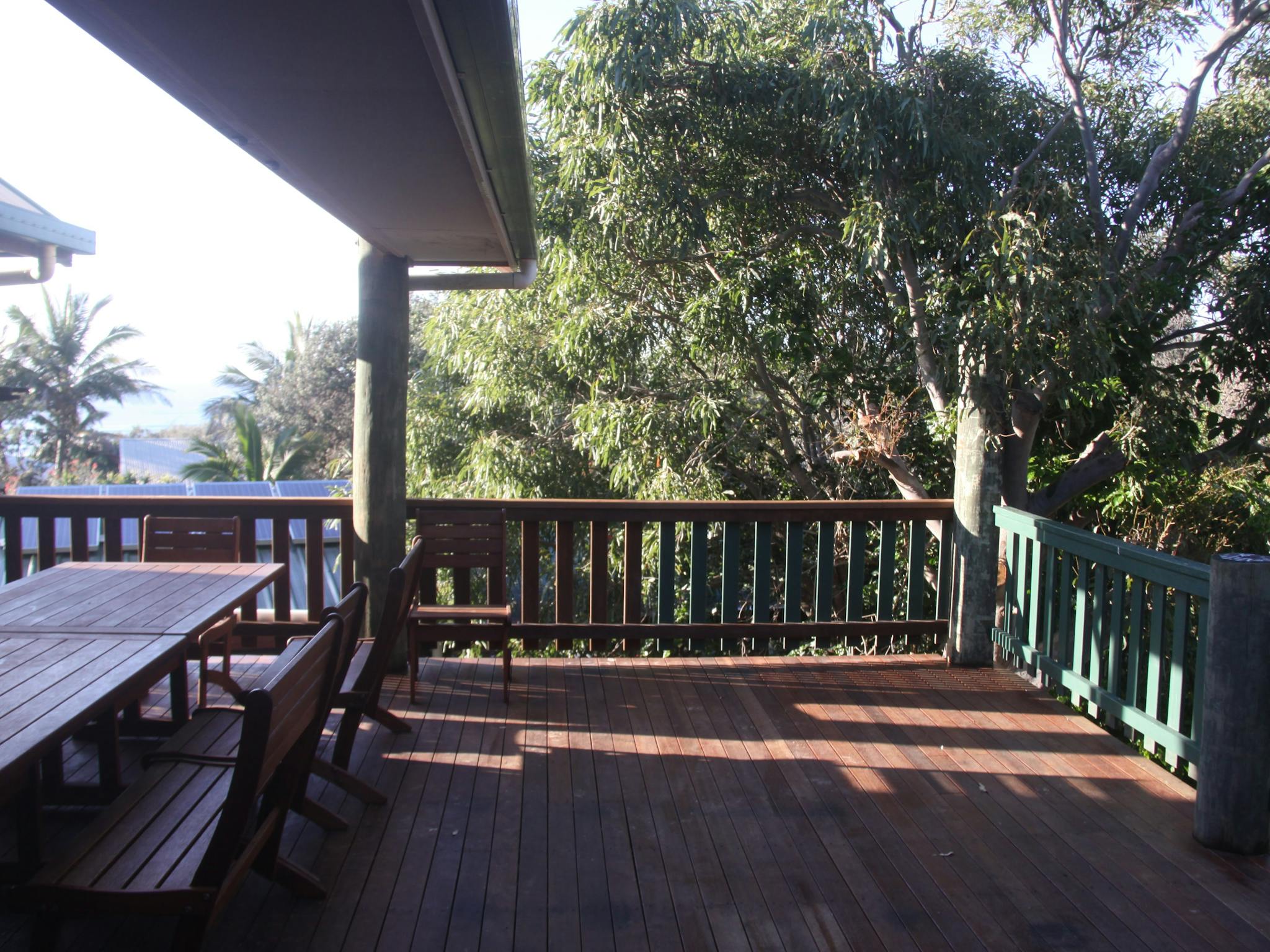 Outdoor dining for 12 on the covered timber deck with views to the ocean Outdoor dining for 12 on the covered timber deck with views to the ocean