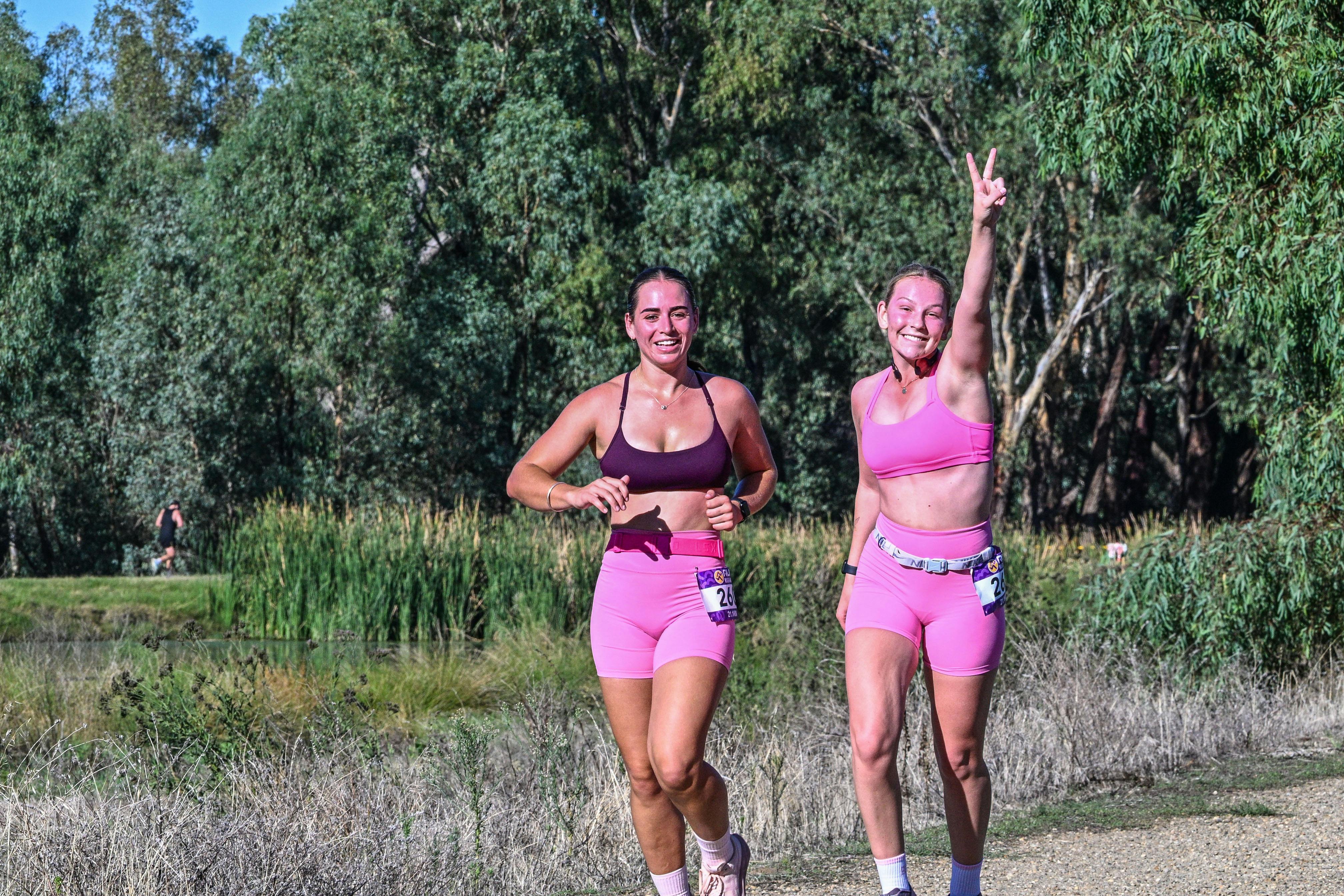 women smiling running