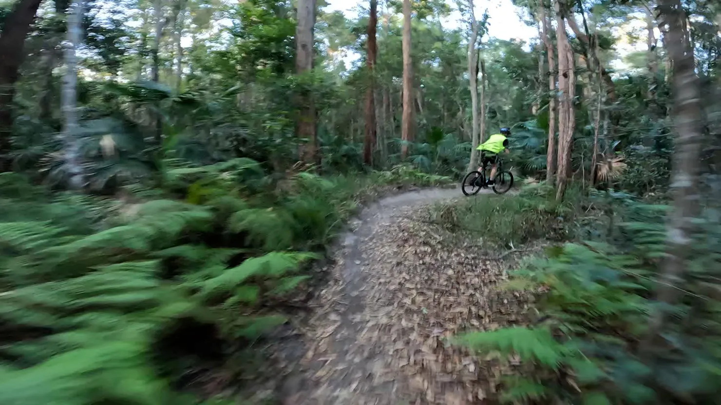 Rider completing hill climb Parklands MTB trail