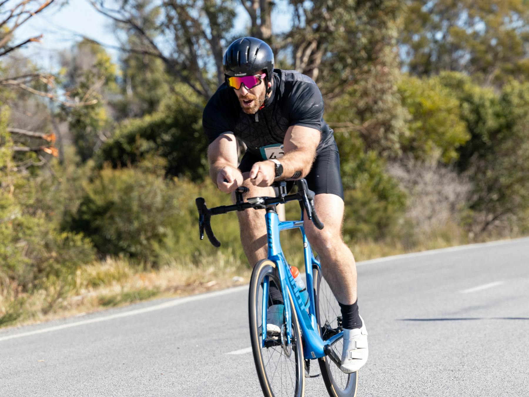 Riding in the Road Bike stage of the Freycinet Challenge at Coles Bay in Tasmania.