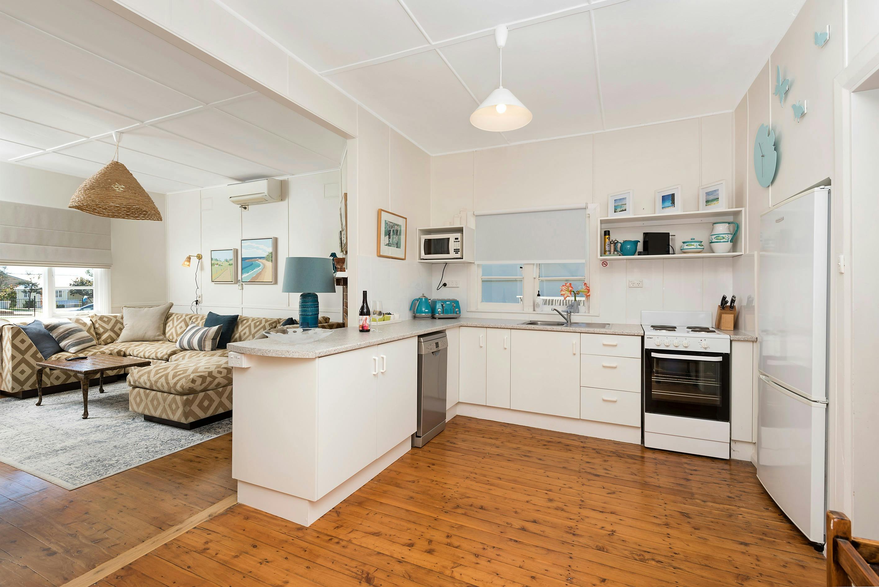 Kitchen with dishwasher, cooking and family sized fridge
