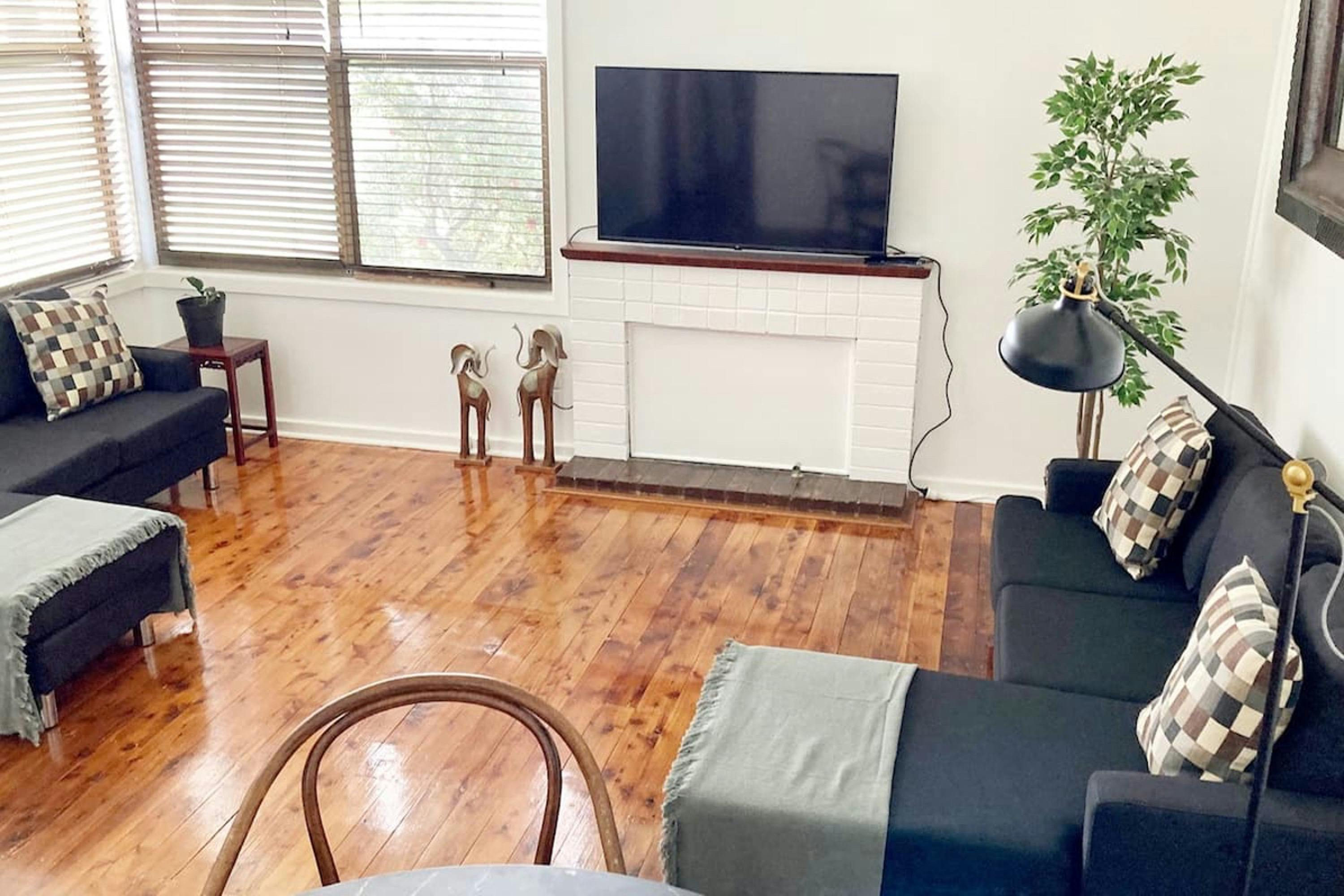 combined lounge and dining room with smart TV and Netflix