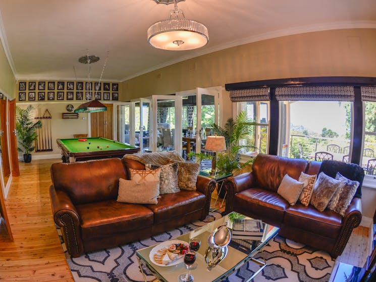 Plush lounge room with billiard table and views across the Jamison Valley