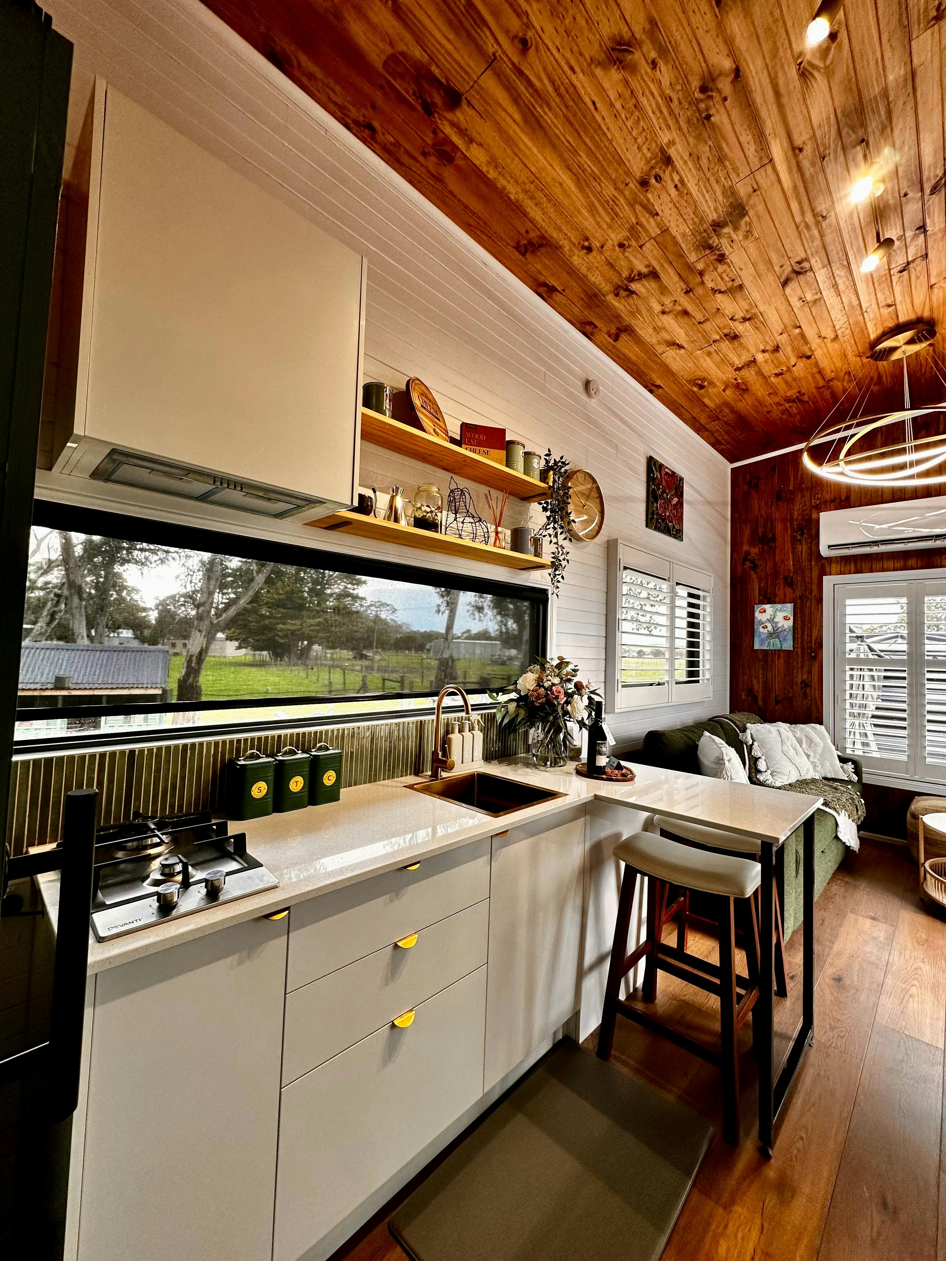 Main kitchen and living area with access to bathroom off the kitchen