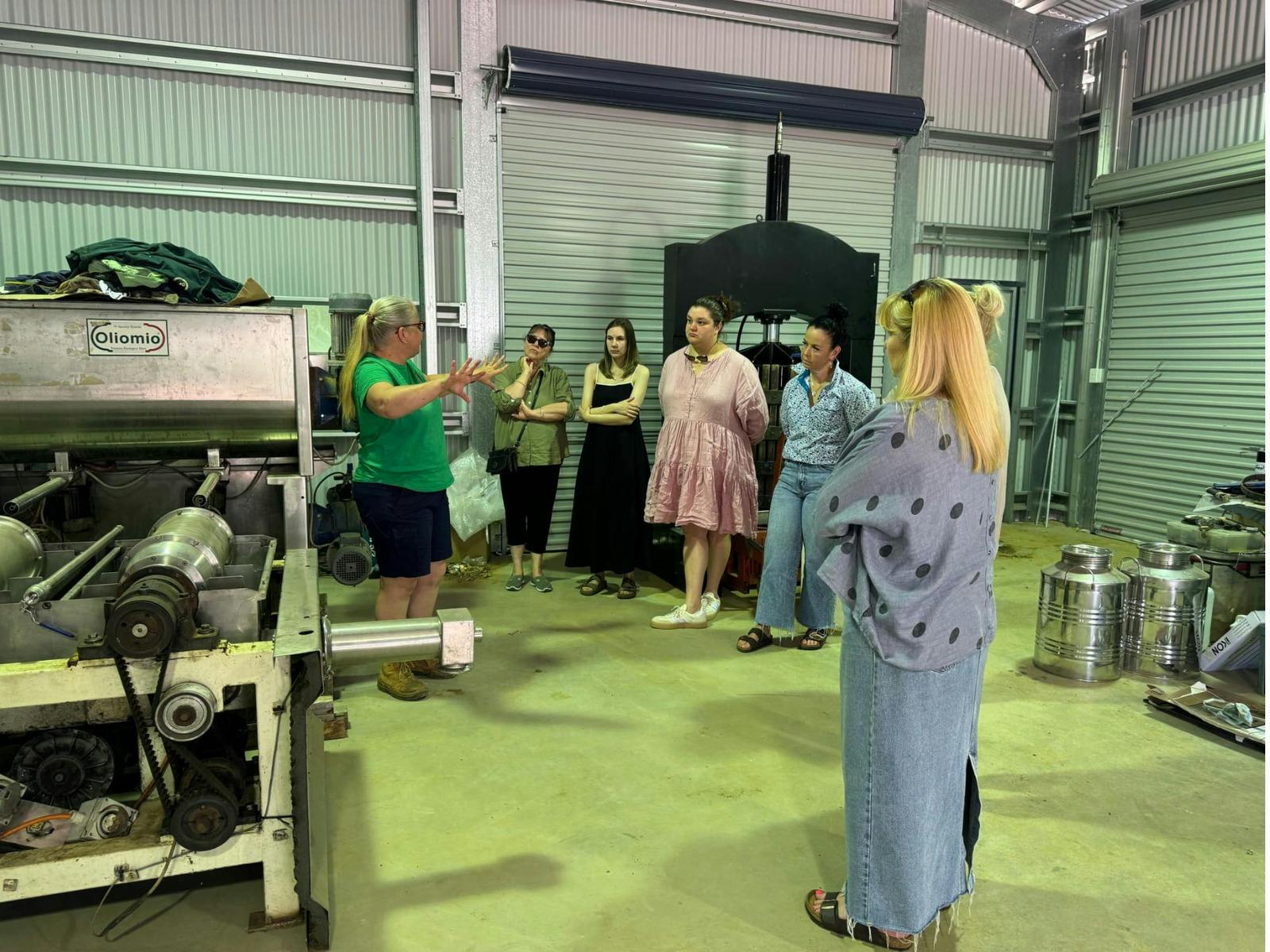 Heidi explaining to the group how olives are processed and ifferences between hot and cold process.