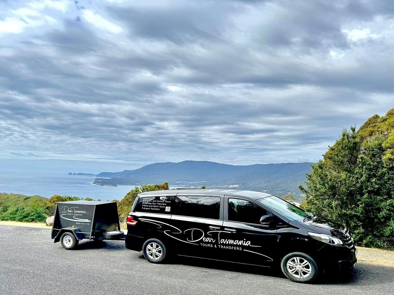 Our 9 seater van with a luggage trailer for convenience.