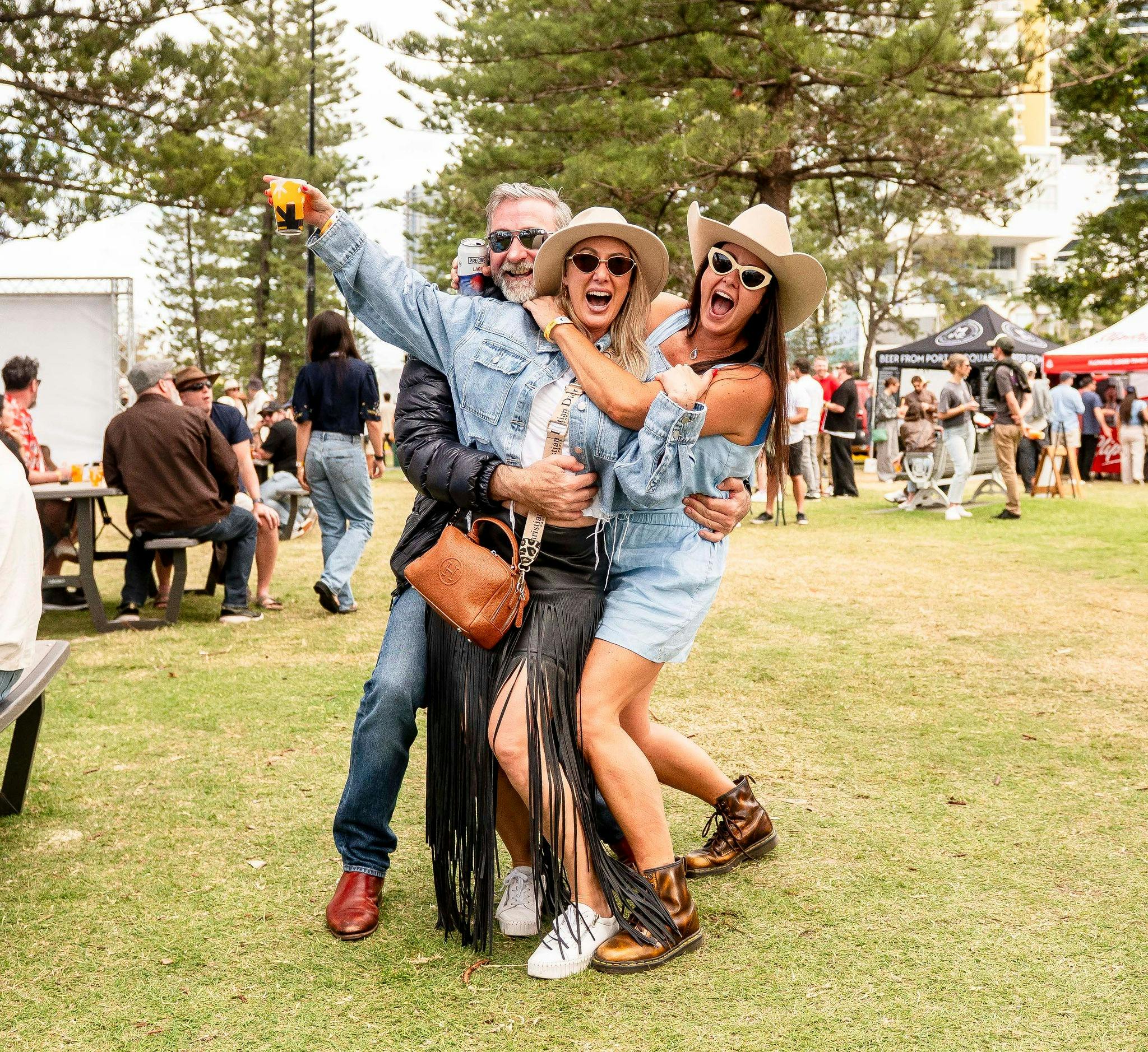 3 people facing the camera smiling having fun at Crafted