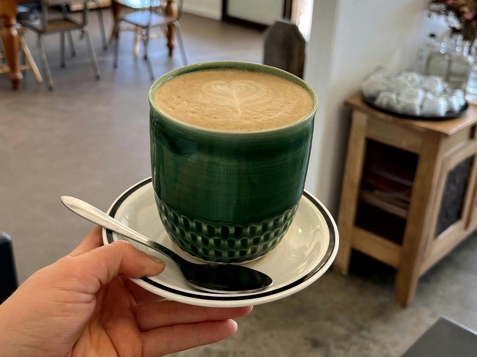 a latte served in  a locally made mug