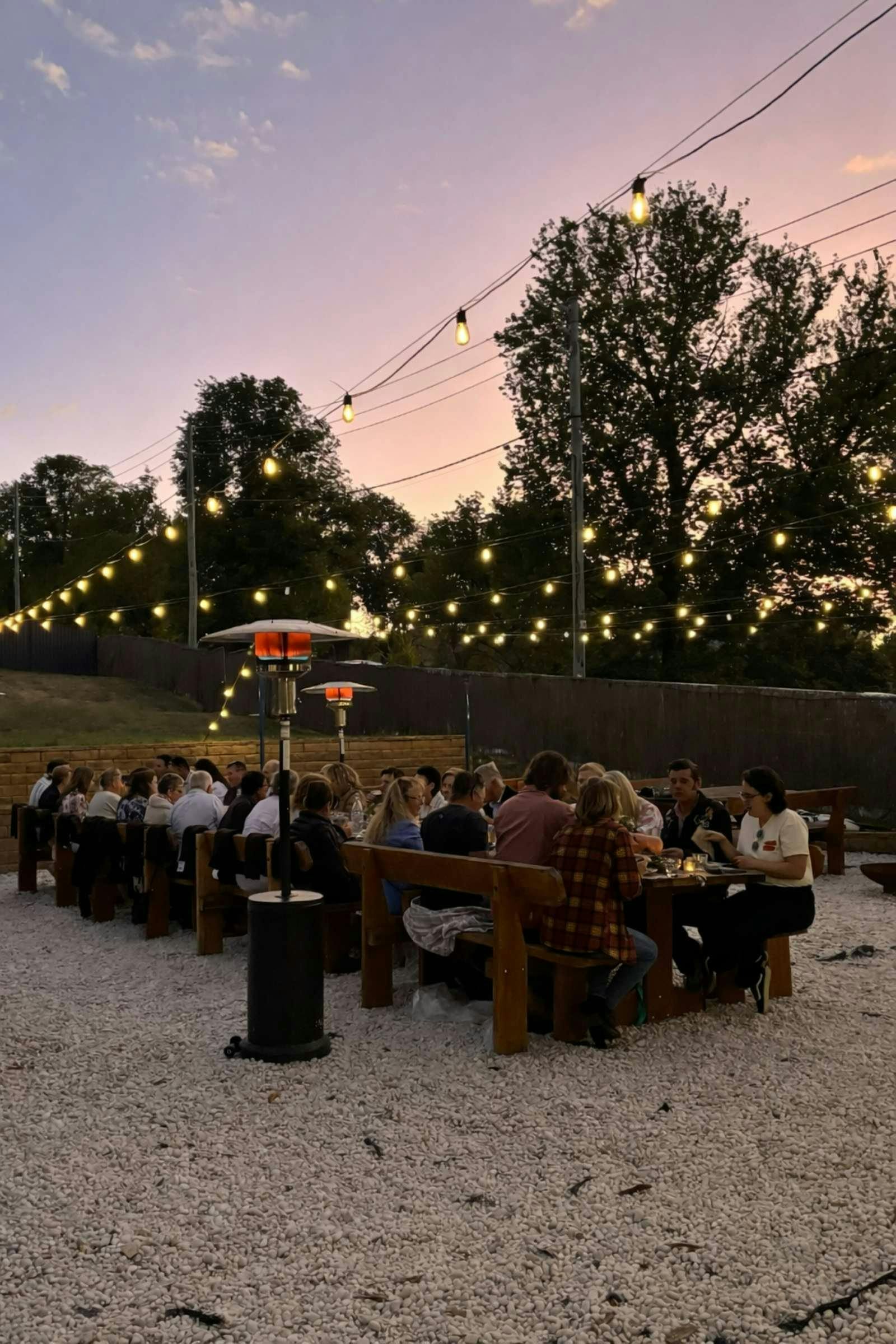 long table in the beer garden at dusk