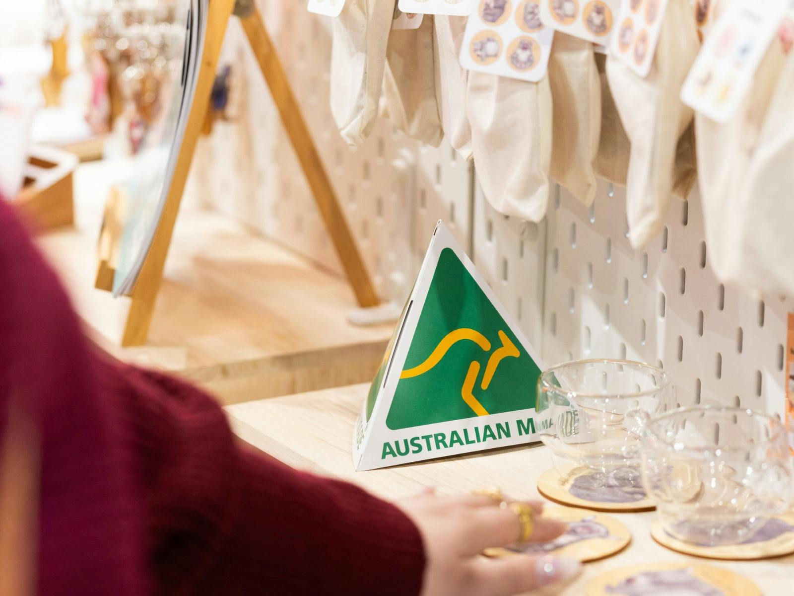 Australian Made green and gold logo on a stall at the market