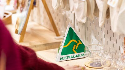 Australian Made green and gold logo on a stall at the market