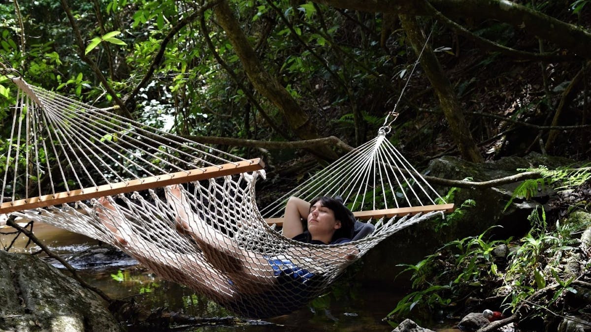 Lady relaxing in hammock at Adjinbilly Retreat