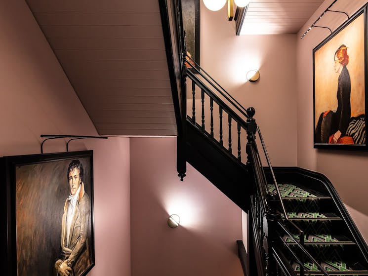 Crystalbrook Albion staircase and portraits by acclaimed Australian artist Ann Cape