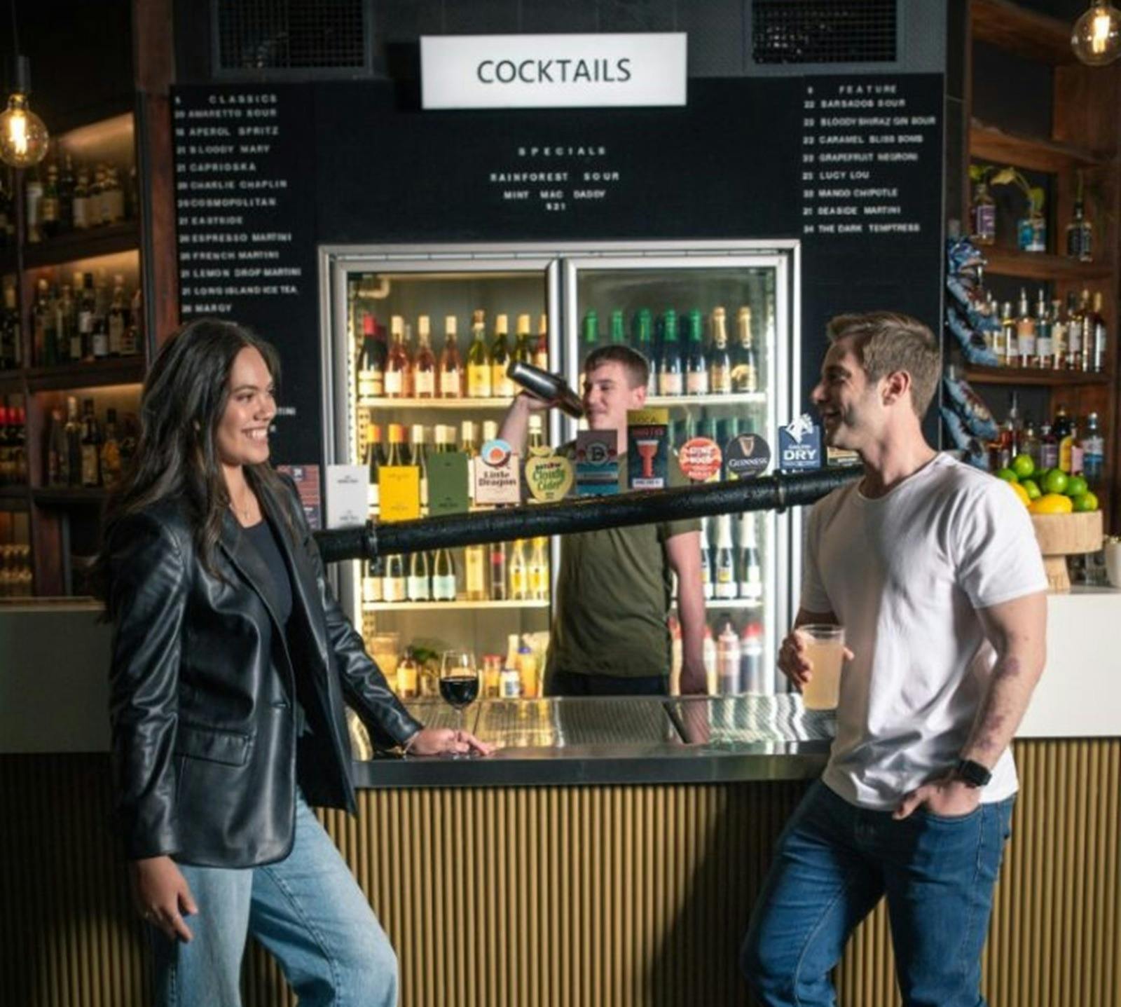 Couple enjoying drinks at the bar