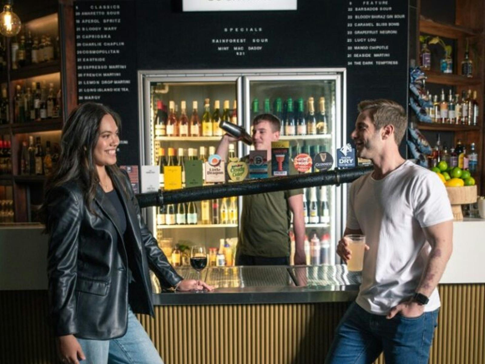 Couple enjoying drinks at the bar
