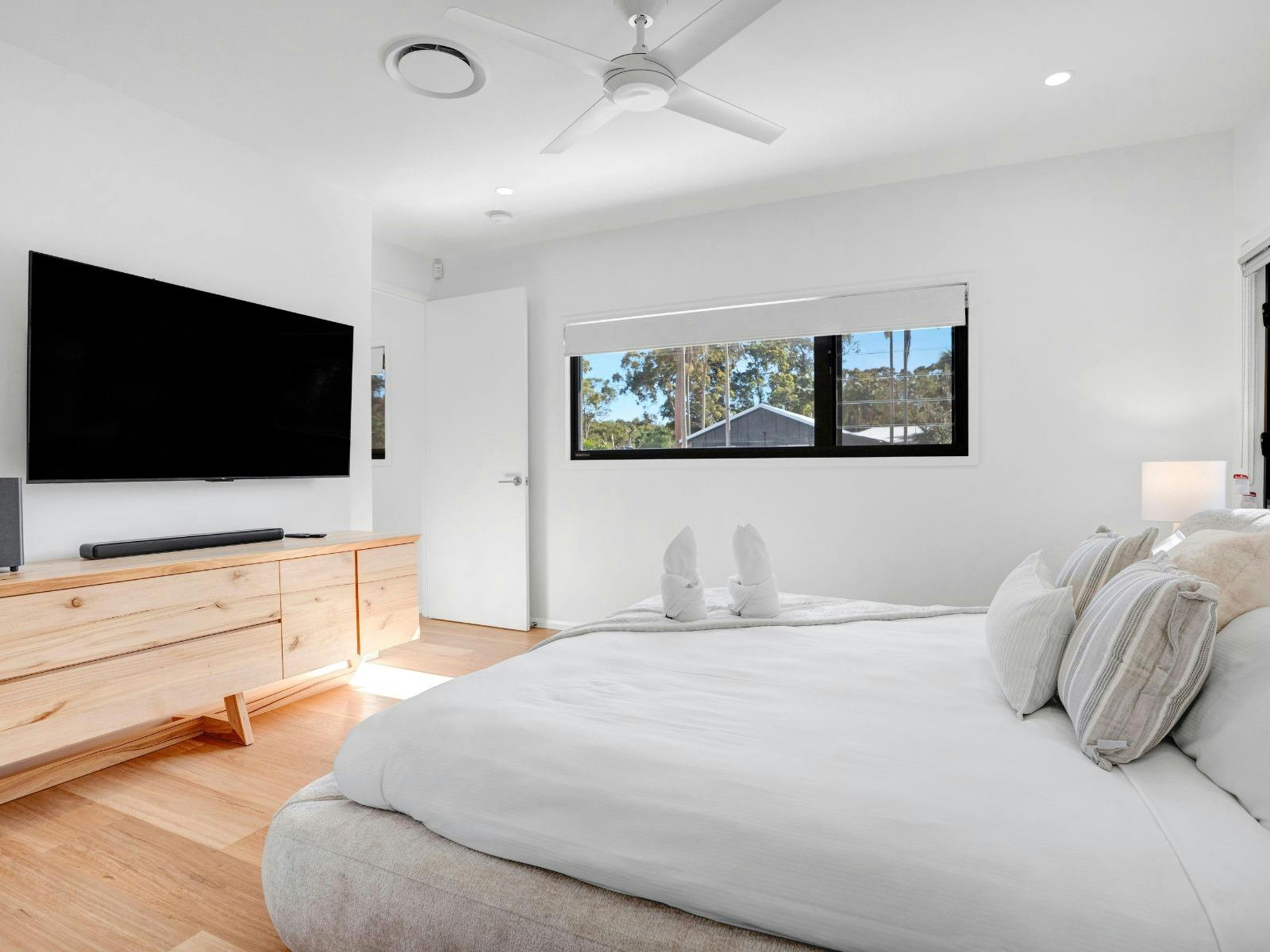 Main king bedroom with Smart TV, walk-in robe and ensuite