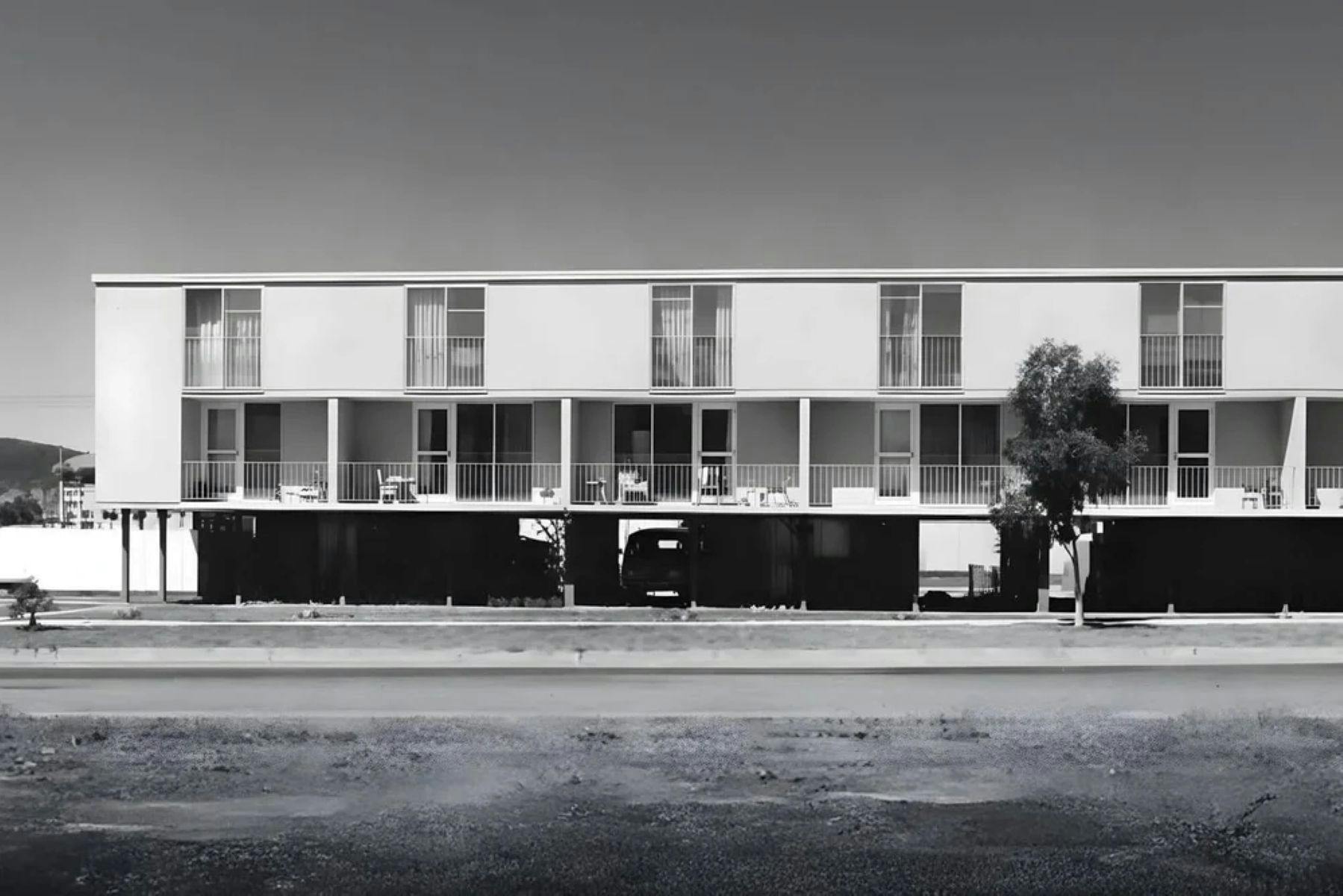 A black and white photo of the Northbourne Ave Flats in brutalist style from the road