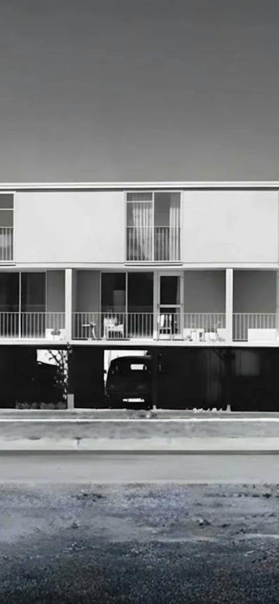 A black and white photo of the Northbourne Ave Flats in brutalist style from the road