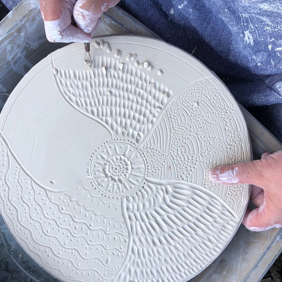 Photo shows carving texture into a porcelain tile