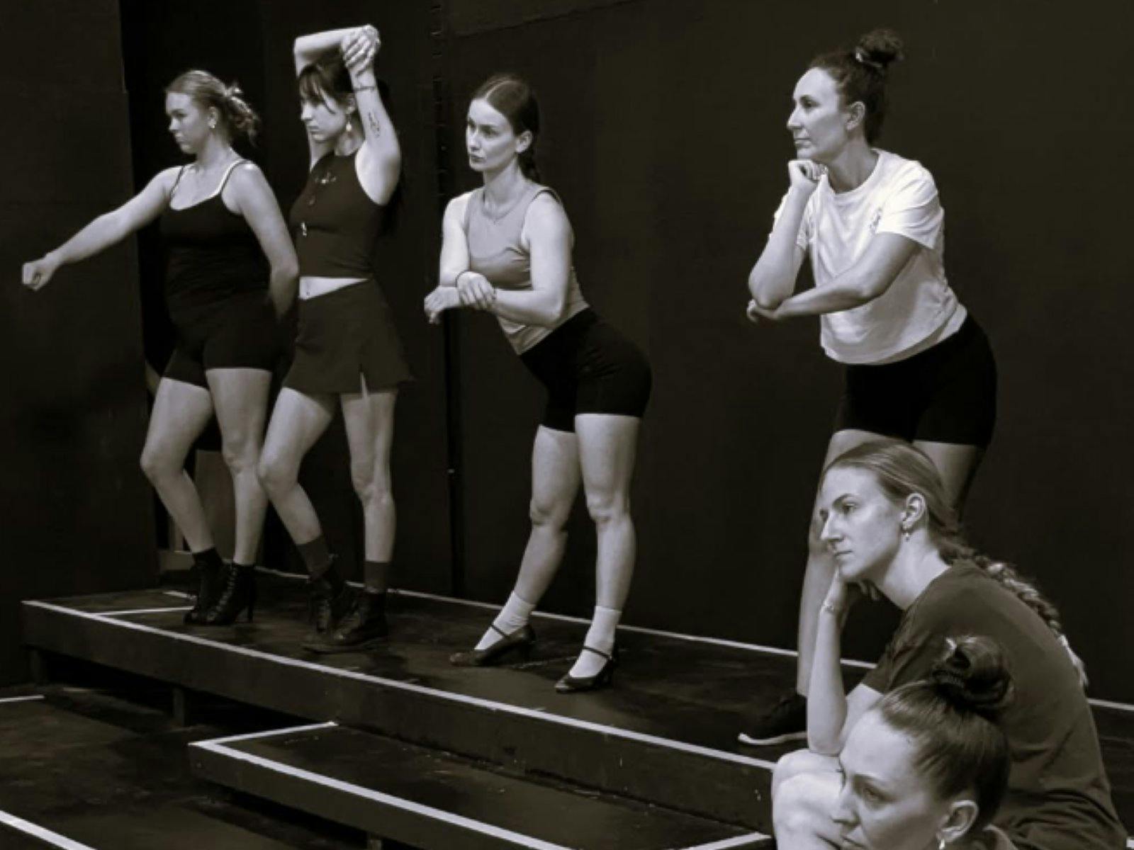 black and white photo of women rehearsing