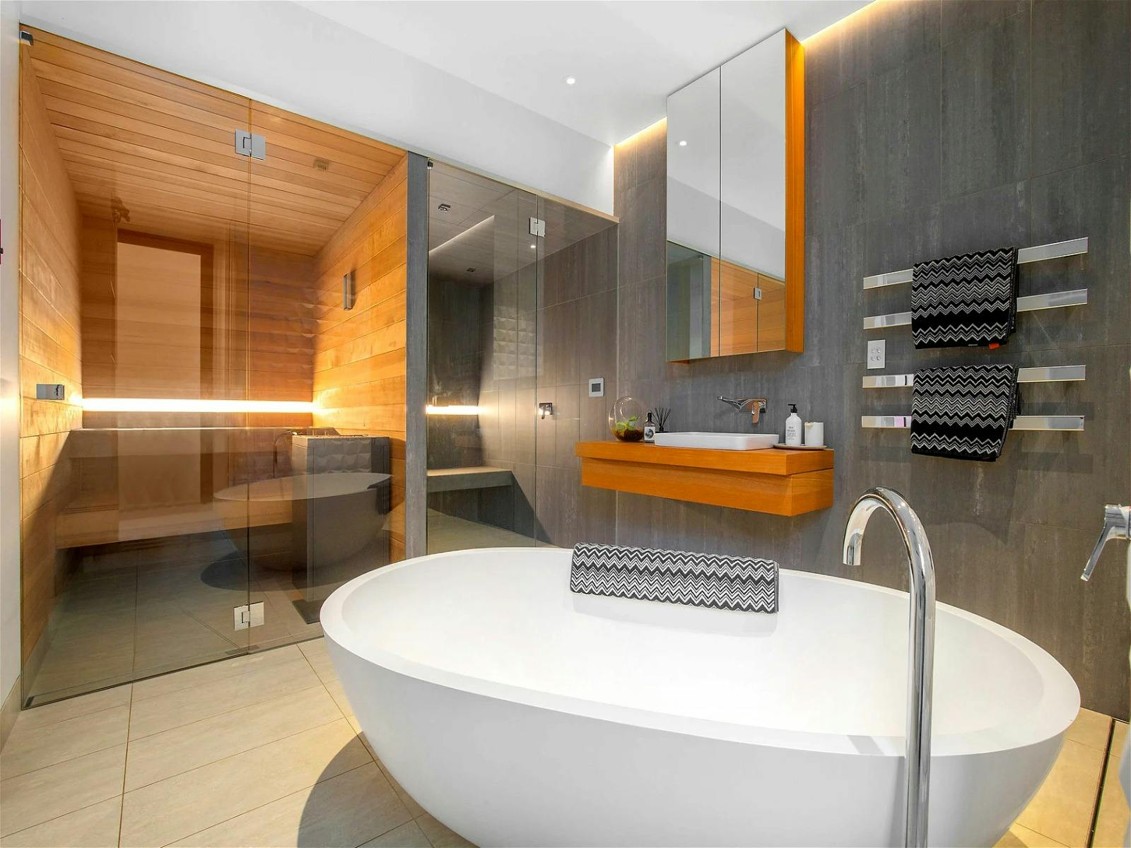the spa bathroom with sauna as well as steam room