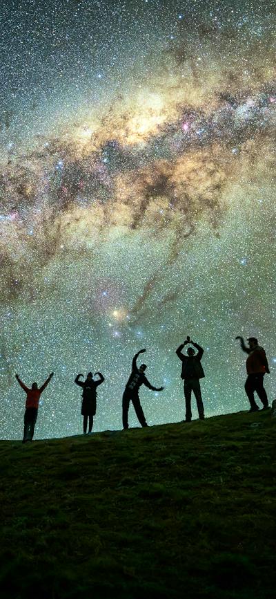 Photographers under the milky way