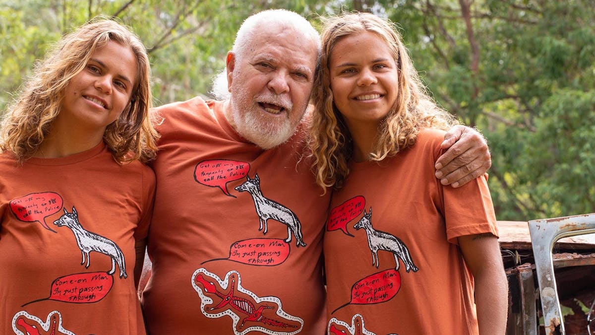 2 young twins either side of our elder all wearing his shirt with a white dog and a red crocodile