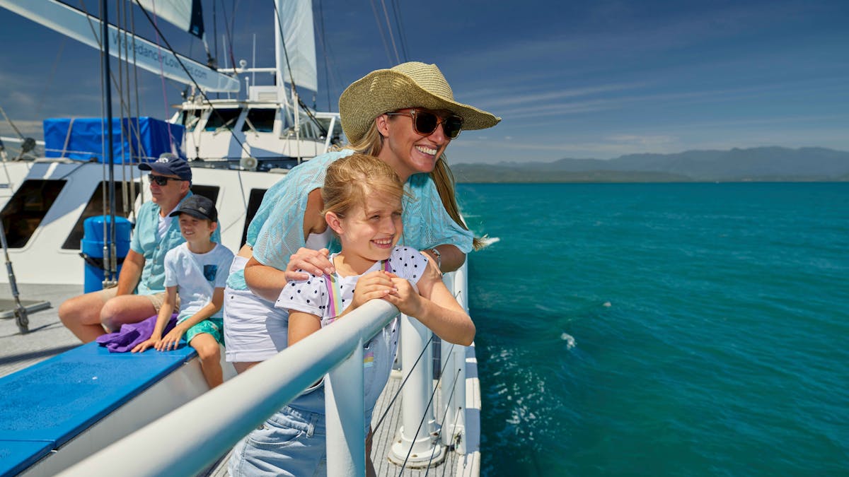 family sailing to Low Isles