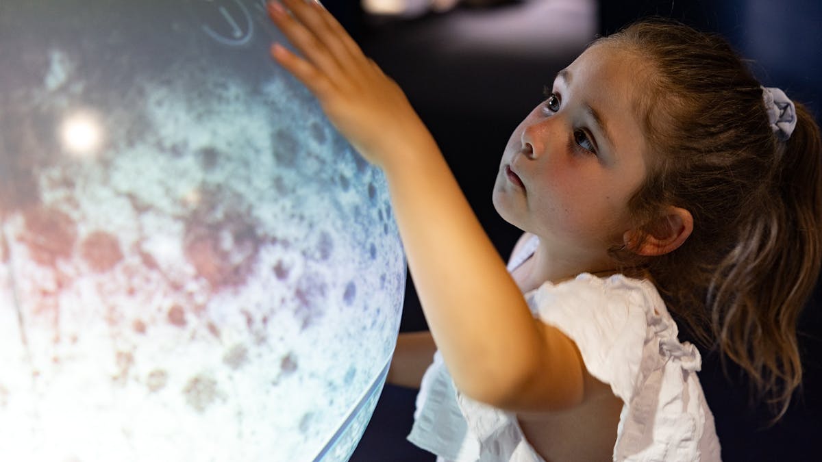 A family enjoying the interactive exhibit at the Charleville Cosmos Centre