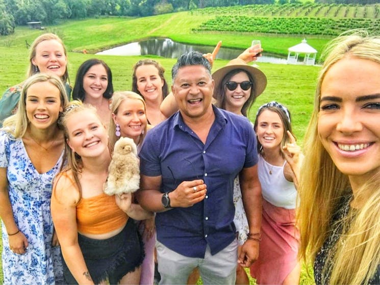 tour group with driver among vineyards