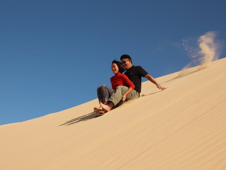 Tandem ride down the high dune