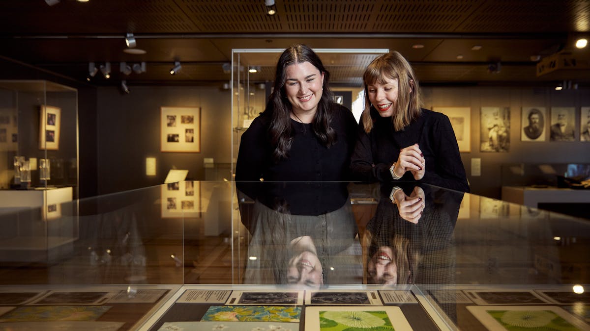 two females looking into a glass display